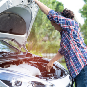 woman checking if her car battery is dead